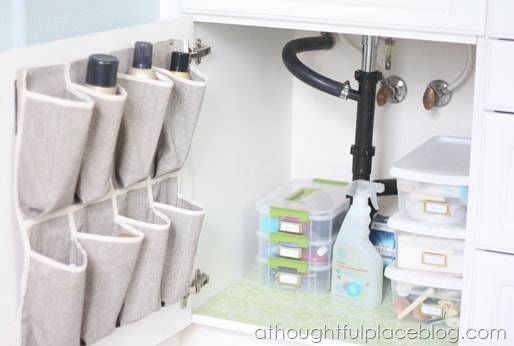 organize your bathroom : shoe organizer inside cabinet